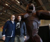 French chocolate maker Jean-Paul Hevin and Richard Orlinski pose next to their four-metre tall chocolate King-Kong in Paris