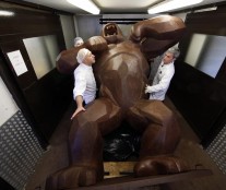Assistants of French chocolate maker Jean-Paul Hevin work on a four-metre tall chocolate King-Kong created by Richard Orlinski in Colombes