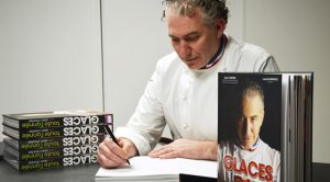 Alain Chartier signs book