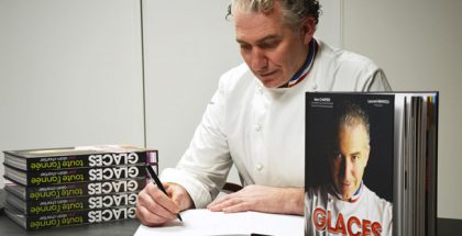 Alain Chartier signs book