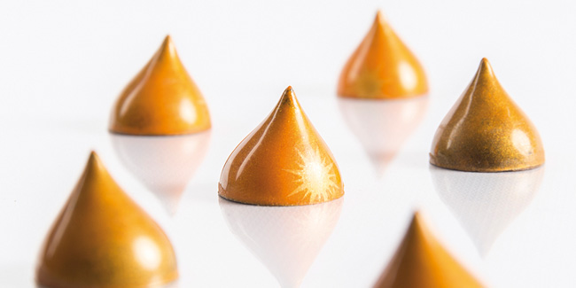 Asian sunrise chocolate bonbon with yuzu and sake by Bart de Gans