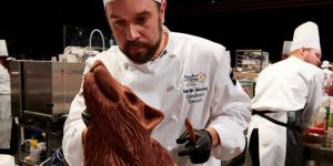 Participant working on a chocolate sculpture