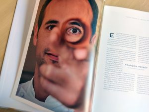 Portrait of François Perret inside his book